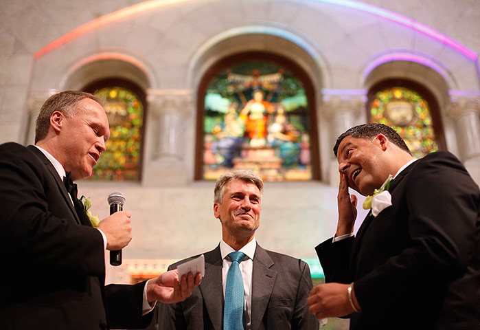 Gay weddings: Al Giraud, right, wipes a tear from his eye as his partner Jeff Isaacson, r