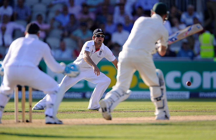 3rd ashes day 1 TJ 2:  Alistair Cook attempts to field a drive from Michael Clarke