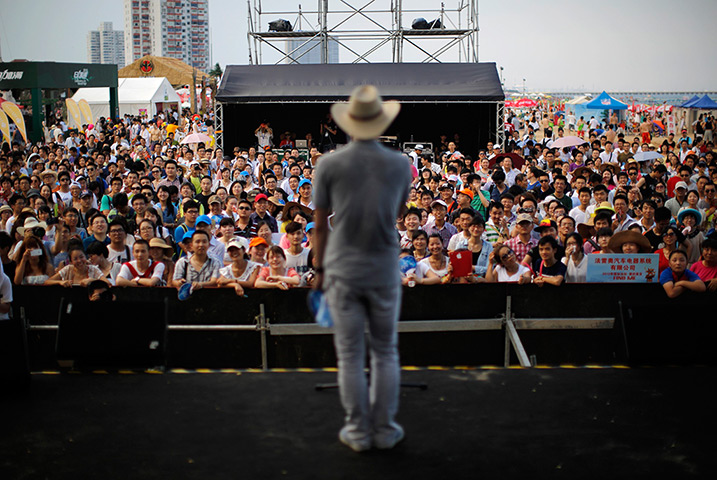 China Valentine's day: A man introduces himself onstage during a matchmaking event in Jinshan beac