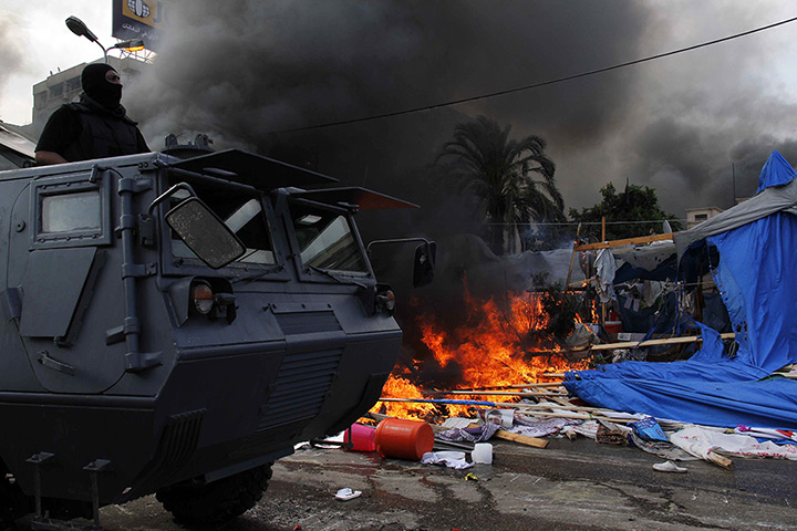 Egyptian camps: Egyptian security forces move in to disperse a protest camp near Cairo's Ra
