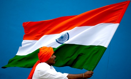 A man holds an Indian flag at Freedom Park in Bangalore. The country celebrates its Independence Day tomorrow.