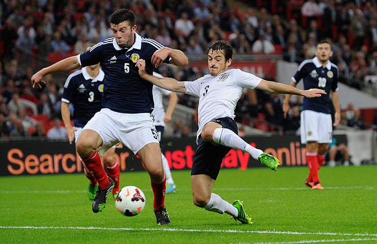 England v Scotland 2: Grant Hanley and Leighton Baines tussle for the ball