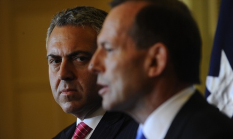 Shadow Treasurer Joe Hockey listens to Opposition Leader Tony Abbott speaking during a press conference in Launceston, Thursday, Aug. 15, 2013.