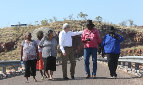 PM Kevin Rudd with traditional owners from Right, Button Joes, Ted Carlton, Edna O'Malley, Minnie Lumai (umbrella) and Helen Gerard on the Ord River Dam, Thursday 15th August 2013.