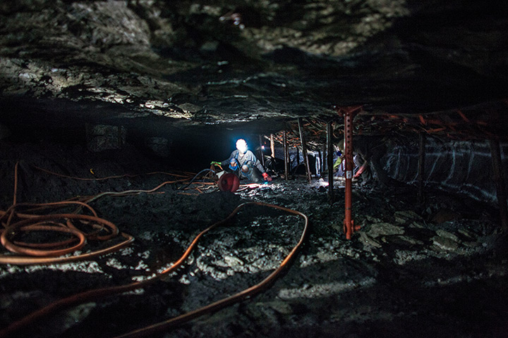 Marikana mine: The working rock face in intense darkness and humidity