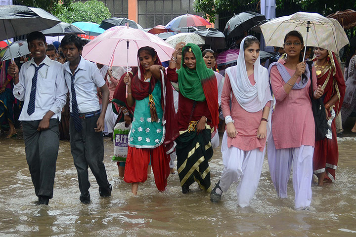 India Independence Day : Indian school students walk along a floo