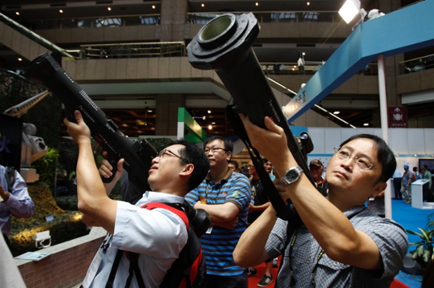 Visitors aim shoulder-fired Kestrel Heat rockets during the Taiwan Aerospace and Defence Technology Expo in Taipei