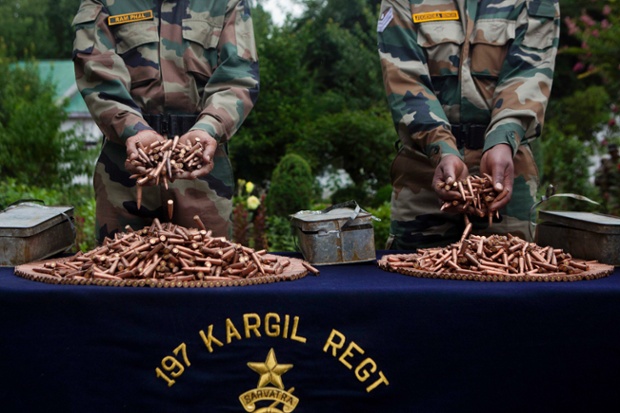 Indian army soldiers display seized ammunition at the army headquarters in Srinagar. The prime minister, Manmohan Singh, said that for relations with Pakistan to improve, it was essential that Islamabad prevent the use of its territory for any anti-India activity
