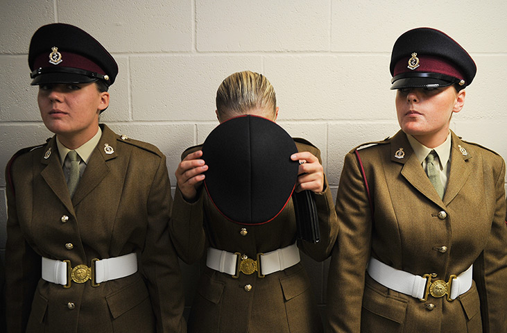 Junior Soldiers: A junior soldier adjusts her cap