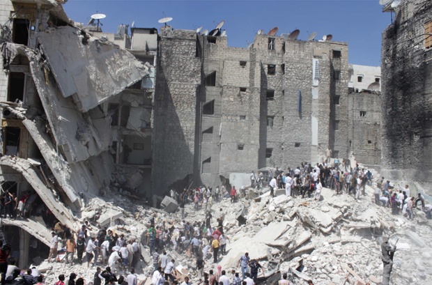 A wider shot of the rubble of collapsed buildings after what activists said was shelling by forces loyal to Syria's President Bashar al-Assad in Aleppo's Bustan al-Qasr district. Photograph: Stringer/Reuters