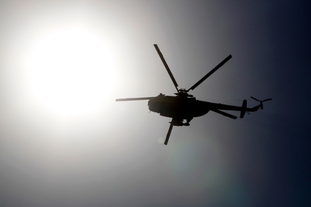 An Egyptian army helicopter is seen as supporters of deposed Egyptian President Mohamed Mursi protest outside Al-Fath Mosque in Ramses square in Cairo. Thousands of supporters of Mursi took to the streets urging a 