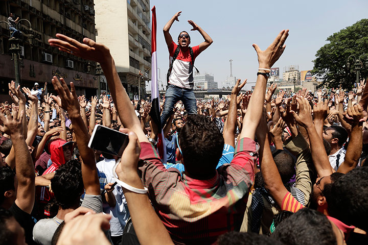 Day 3: a Morsi supporter leads protesters in chants