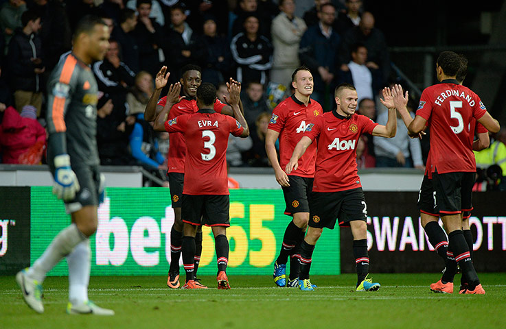 Swansea v United: United celebrate the 4th goal scored by Welbeck 