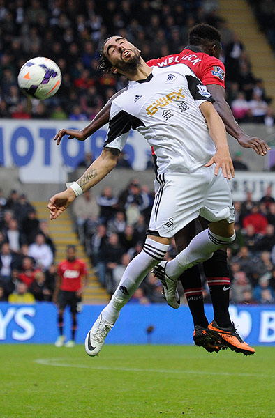 Swansea v United: Chico Flores and Danny Welbeck compete