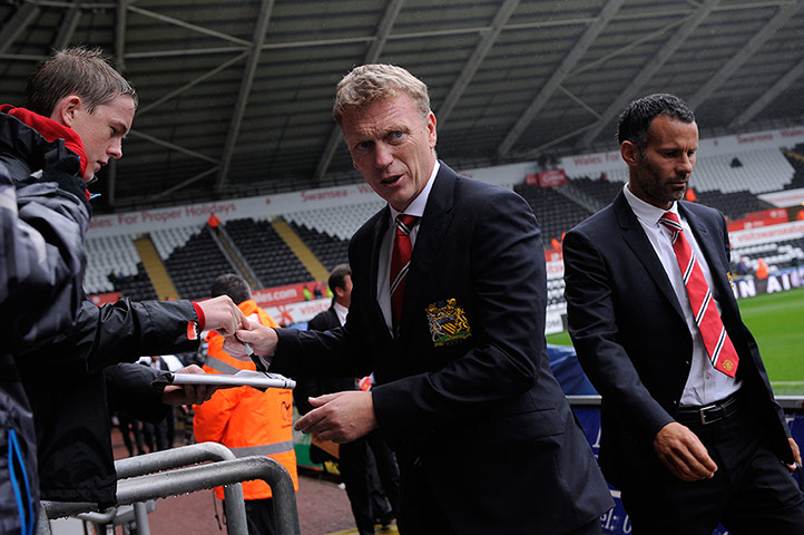 Swansea v United: David Moyes signs an autograph as he walks into the ground 