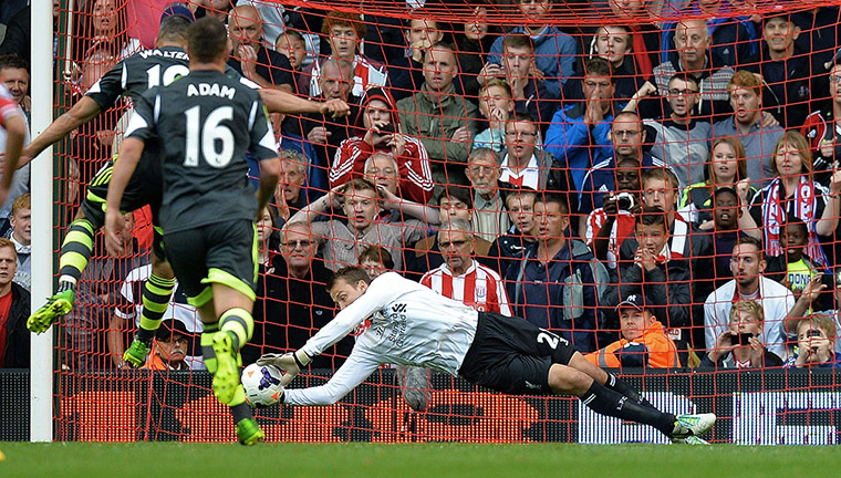 saturday round-up: Liverpool's goalkeeper Simon Mignolet saves a penalty