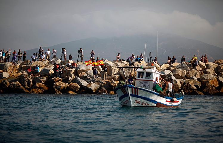 Gibraltar protests: Men wave Spanish national flags during a protest by Spanish fishermen at th