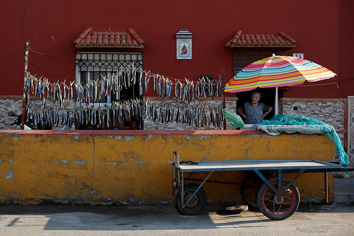 Gibraltar protests: A woman dries fish outside her home near Atunara Port in Linea de la Concep