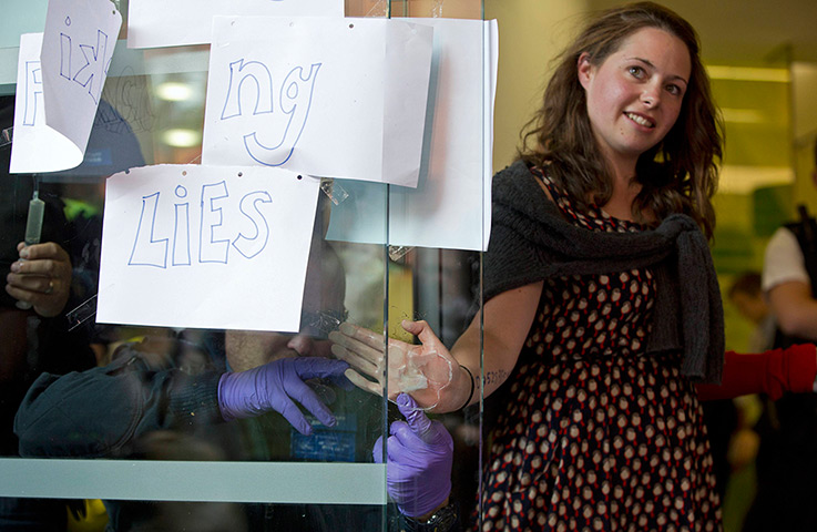 Fracking protests: Police remove an anti-fracking activist who had superglued herself to the w