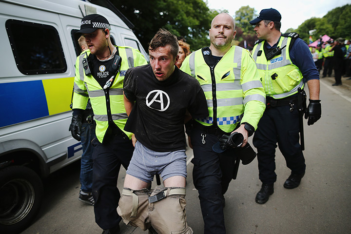 Fracking protests: Police officers arrest protesters outside a drill site in Balcombe