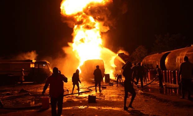 Firefighters try to contain a fire at an informal diesel fuel depot in Lagos, Nigeria.