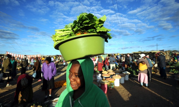 A woman shops for vegetables in Jambanja market in Seke, Zimbabwe. President Robert Mugabe's party has claimed victory in the elections branded a sham by his rival Prime Minister Morgan Tsvangirai.