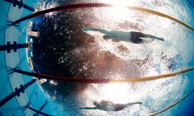 Australia's James Magnussen, top, swims in a Men's 50m freestyle heat at the FINA Swimming World Championships in Barcelona, Spain.