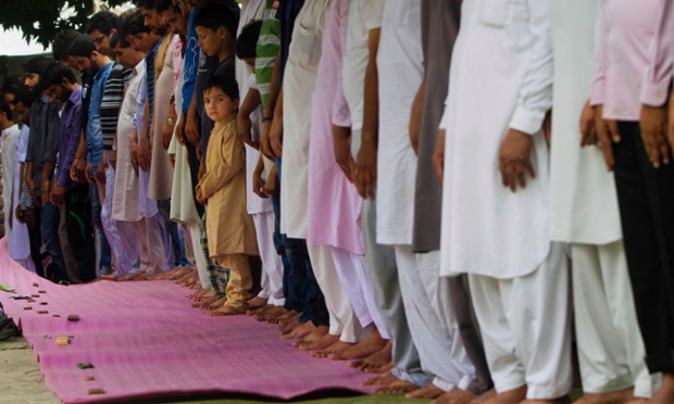 Kashmiri Shia Muslims pray on Jumat-ul-wida, the fourth and last Friday of the Muslim holy month of Ramadan, outside a mosque in Srinagar, India.