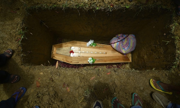 Relatives and villagers gather around the coffin of Rahul Singnar, 22. Singar died during violent clashes in Diphu, in the Karbi Anglong hills district of the Indian Assam state. Unrest has recently escalated, with two people being killed by police fire.