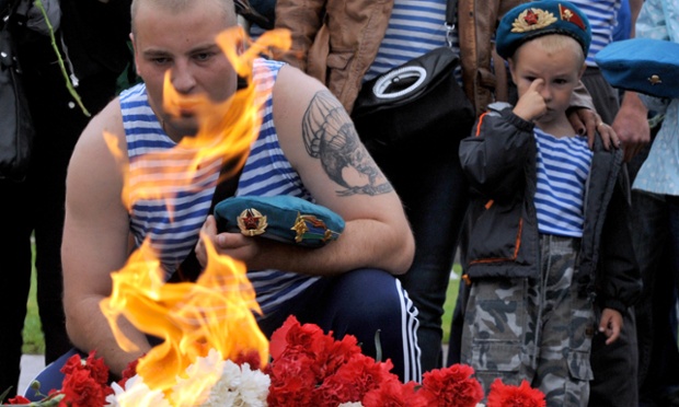 It's a memorable day for paratroops in Russia, too. Here airborne veterans pay tribute in front of the Eternal Flame monument in central St. Petersburg on the Day of Paratroops.