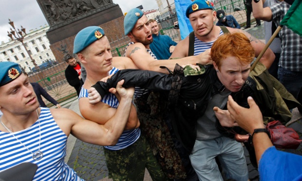 Former paratroopers shove gay rights activist Kirill Kalugin aside to stop his one-man protest in St. Petersburg, Russia. The former servicemen were gathered in central St. Petersburg to celebrate Russian Paratroopers Day, an annual holiday for the Russian airborne troops celebrated since the Soviet era days.