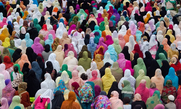 Kashmiri Muslim women offer prayers outside the Grand Mosque on the last Friday of Ramadan in Srinagar, India.