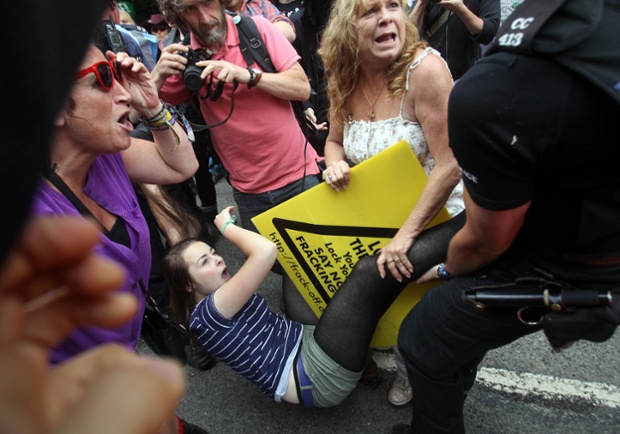 There's a fracas at the fracking site in Balcombe West Sussex as police tackle a protester as energy company Cuadrilla started testing equipment ahead of exploratory oil drilling.