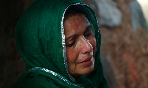 A devout Muslim woman cries as she offers   prayers at an ancient mosque, now partly in ruins, before breaking her fast in New Delhi, India.