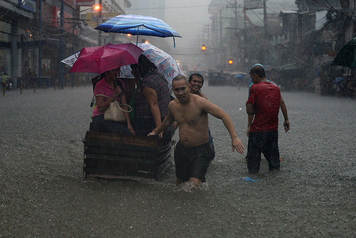 Manila floods: Major roads were impassable in Manila as floodwaters reached waist or neck 