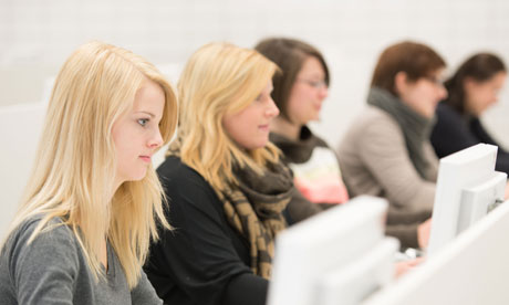 female student at computer in office
