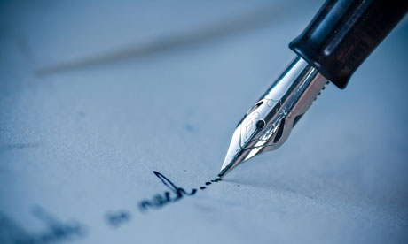 Close-up of pen writing on an envelope