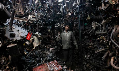 Indian boy with car parts