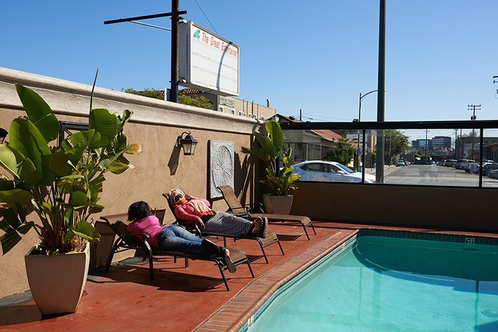 FGM: Two patients relax by their hotel pool