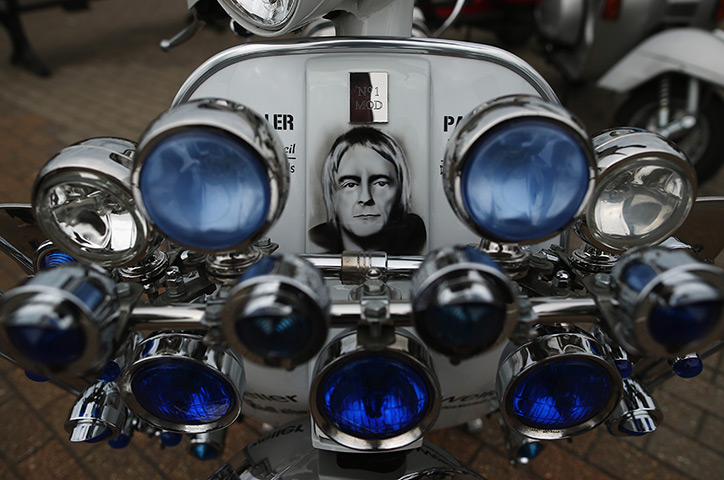 Weekend in pictures: Ryde, UK:  A scooter with a Paul Weller design on sits on the harbour durin