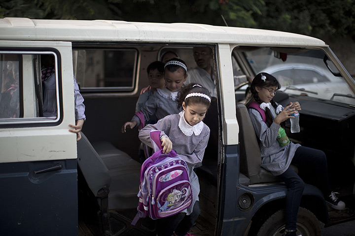 Weekend in pictures: Gaza City, Gaza: Palestinian school children get off a minibus as they arri