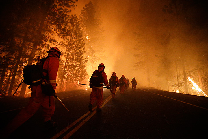 Wildfire update: Inmate firefighters walk along Highway 120