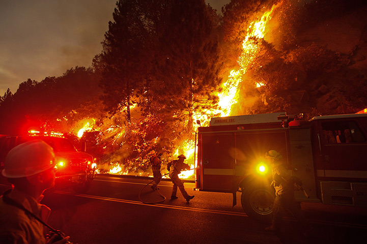 Wildfire update: Firefighters battle the Rim Fire outside of Yosemite National Park as nears