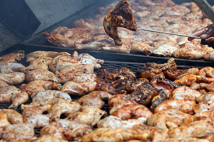 Notting Hill carnival: Caribbean jerk chicken being cooked
