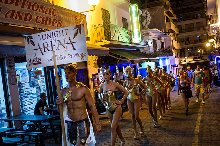 Ibiza summer: Go-go dancers promote their club-night in the 'West End' area in San Antoni