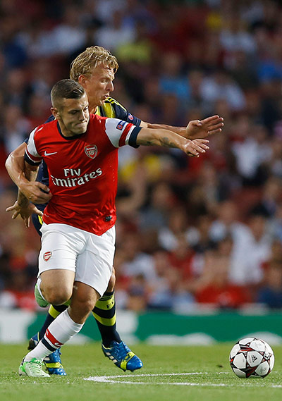 arsenal: Jack Wilshere tussles with Dirk Kuyt