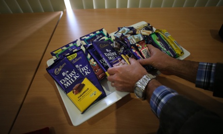 Media help themselves to samples during a tour of the Cadbury factory in Tasmania this morning, Wednesday 28th August 2013