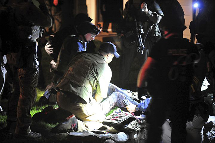 Boston Marathon pics: Dzhokhar Tsarnaev is restrained and given first aid. 