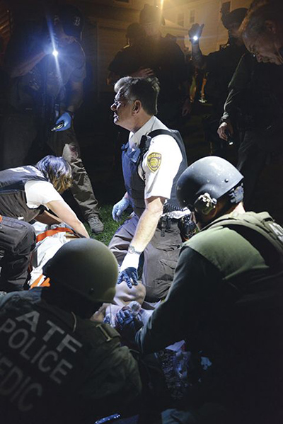 Boston Marathon pics: Officers prepare to stretcher Dzhokhar Tsarnaev away from the scene