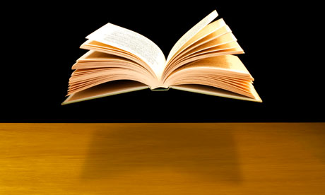 Open book floating above desk